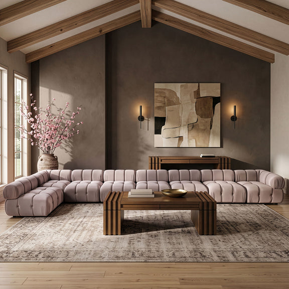 Light beige velvet L-shaped sectional sofa with tufted seat cushions and back panels.