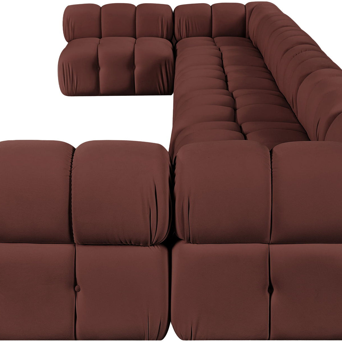 Dark red modular sectional sofa with tufted cushions and deep, rounded backrest