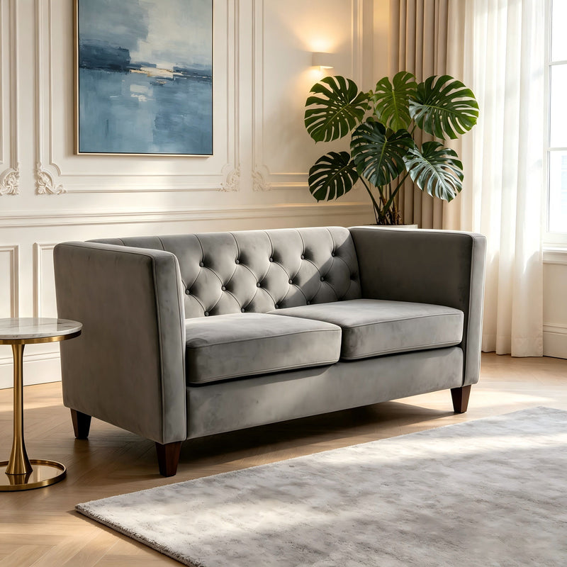 Light gray button-tufted loveseat with square arms and dark wooden legs