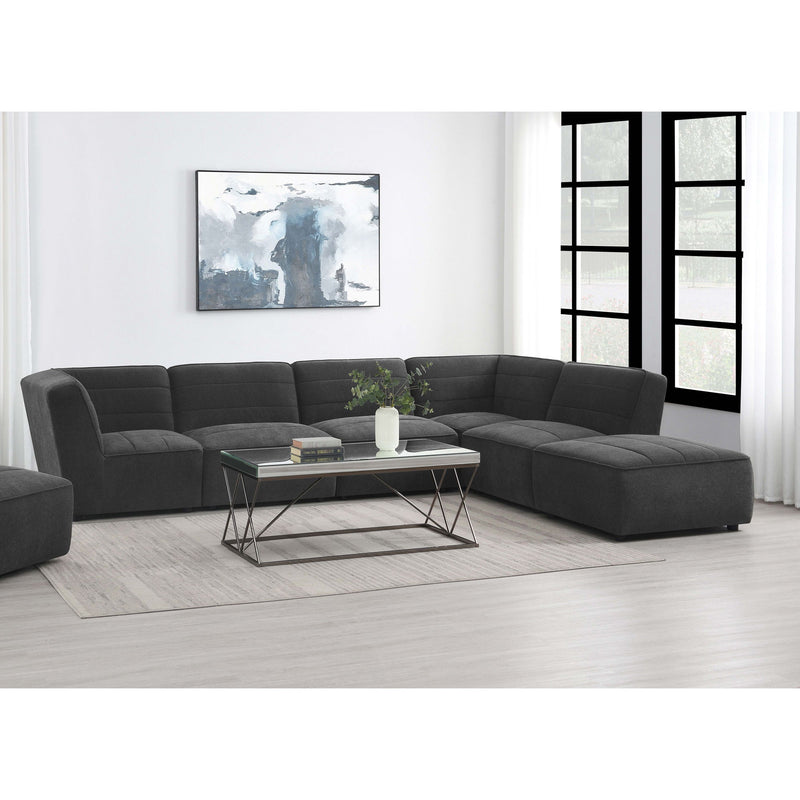 Charcoal modular sectional sofa with chaise extension and tufted back cushions