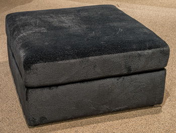 Oversized accent ottoman in dark charcoal fabric with a square cushioned top