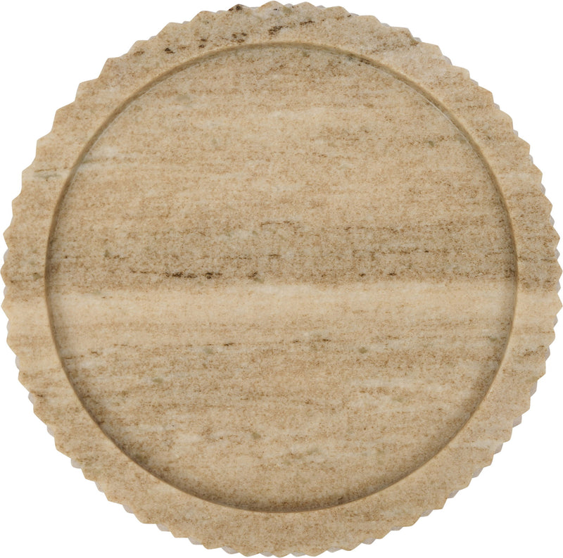 Close-up of round beige genuine marble tray with textured scalloped edge
