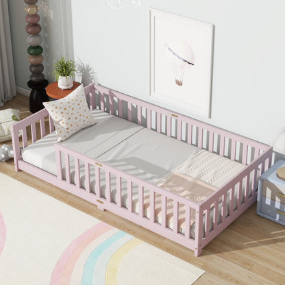 Pink twin floor bed with safety guardrails and slatted fence rails