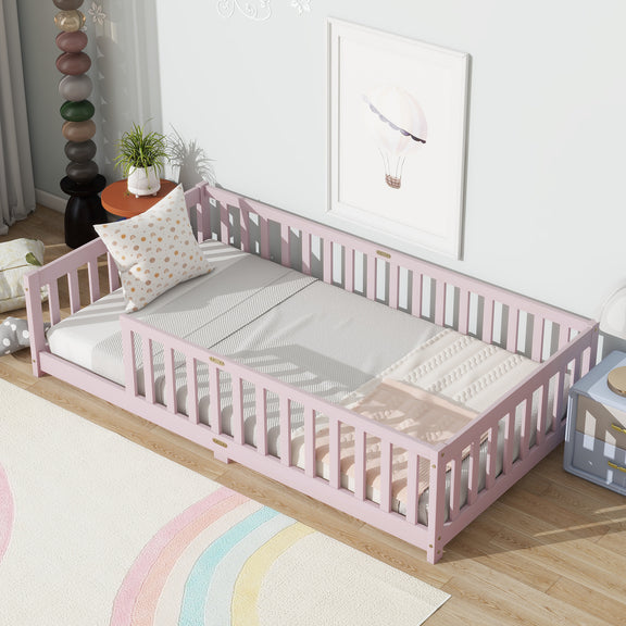 Pink twin floor bed with safety guardrails and slatted fence rails