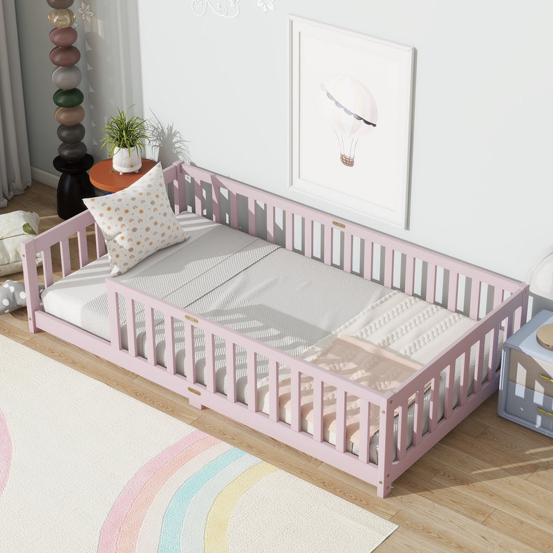 Pink twin floor bed with safety guardrails and slatted fence rails
