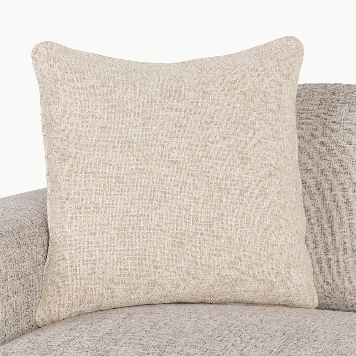 Light tan textured woven square throw pillow on sofa