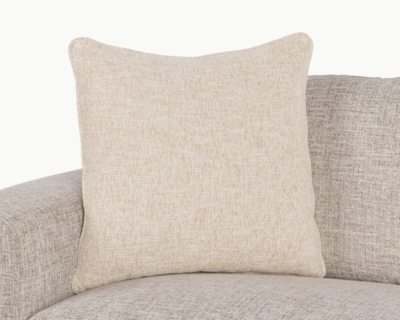 Light tan textured woven square throw pillow on sofa