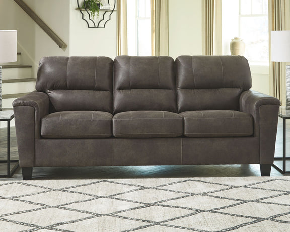 Smoke gray queen sofa sleeper with mattress extended and three tufted back cushions