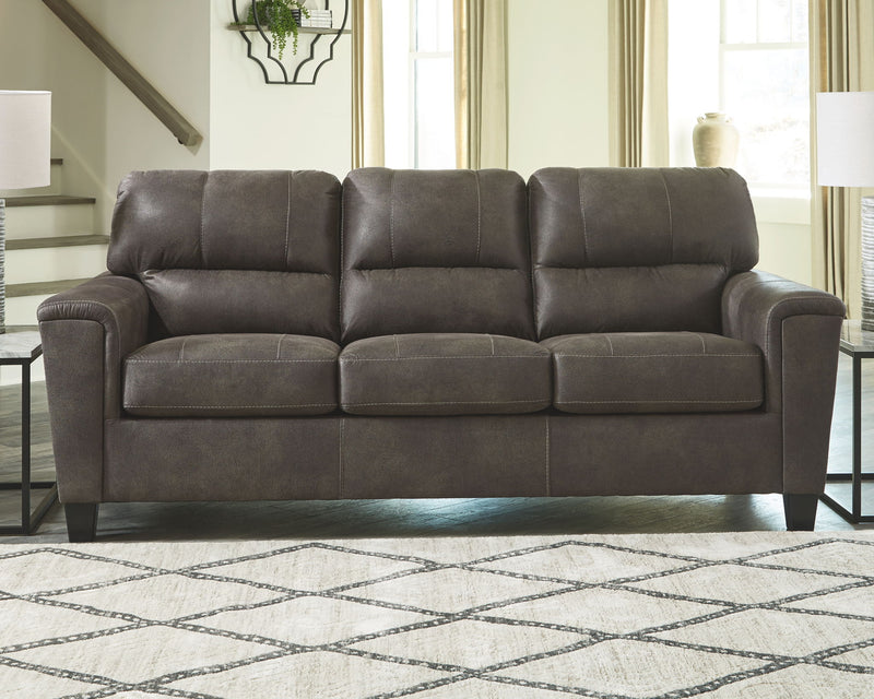 Smoke gray queen sofa sleeper with mattress extended and three tufted back cushions