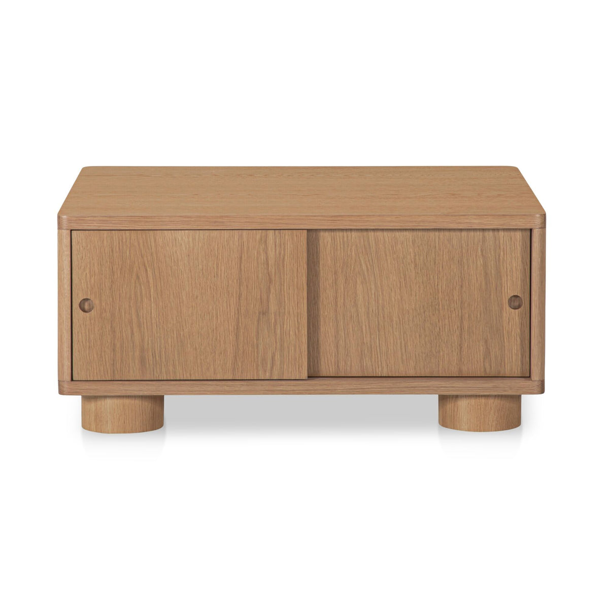 Natural wood storage coffee table with two front cabinet doors and thick turned legs