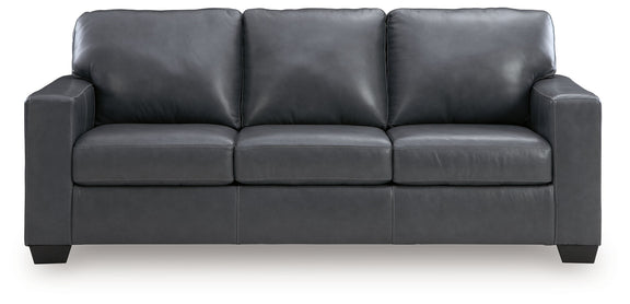 Dark gray upholstered sofa with three seat cushions and wide padded arms