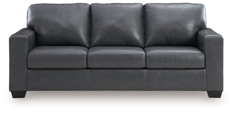 Dark gray upholstered sofa with three seat cushions and wide padded arms