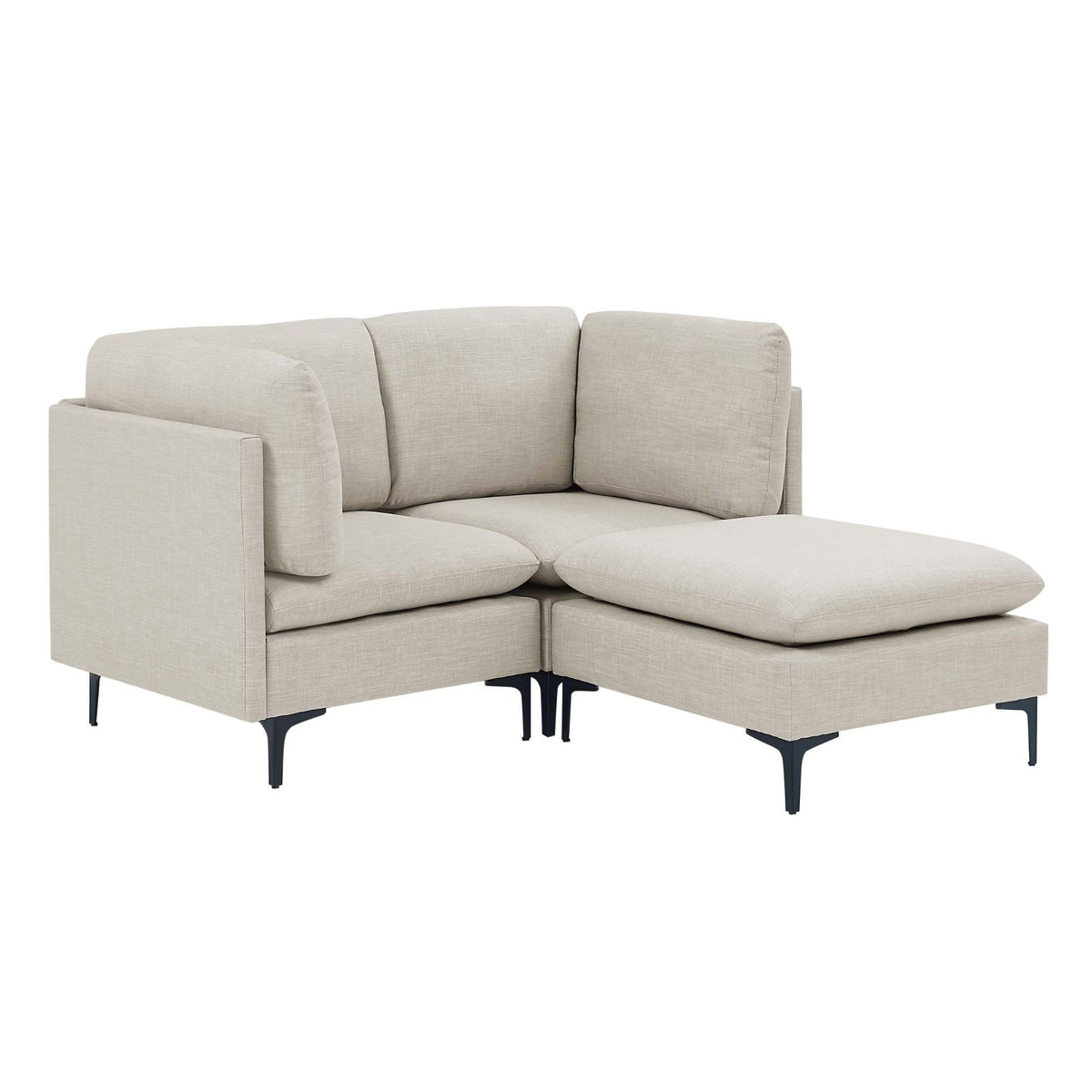 Beige upholstered modular sectional with tall legs and chaise-style ottoman extension