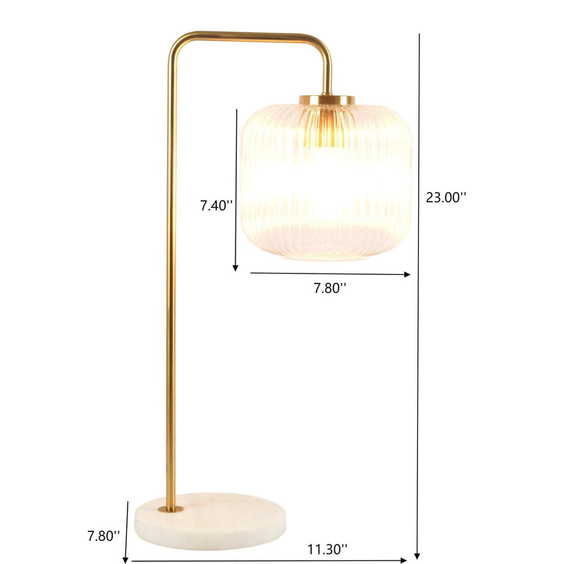 Gold table lamp with clear ribbed glass globe shade and white marble round base
