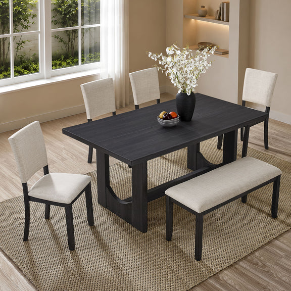 Rectangular dark dining table with four beige upholstered dining chairs