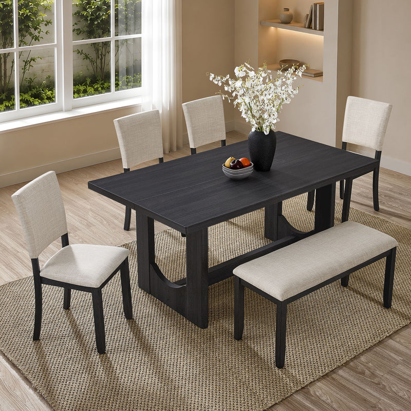Rectangular dark dining table with four beige upholstered dining chairs