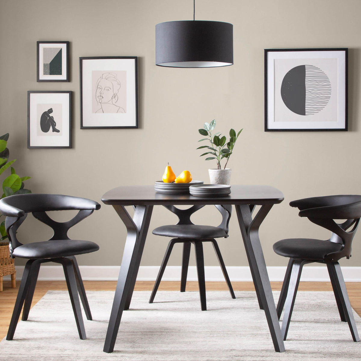 Black mid-century dining chair with curved arms, rounded backrest, and swivel base
