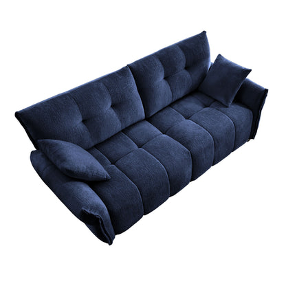 Blue textured fabric sofa with deep seat, tufted back, and rounded arm cushions