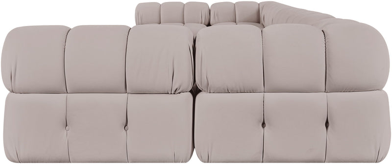 Light gray U-shaped modular sectional sofa with tufted cushions and rounded armrests