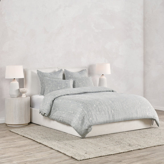 French herringbone duvet in storm gray, neatly draped over bed bedding