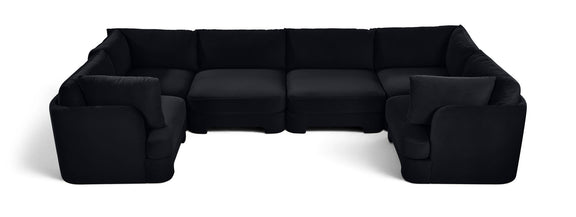 Black velvet U-shaped sectional sofa with padded backrest and wide arm sections