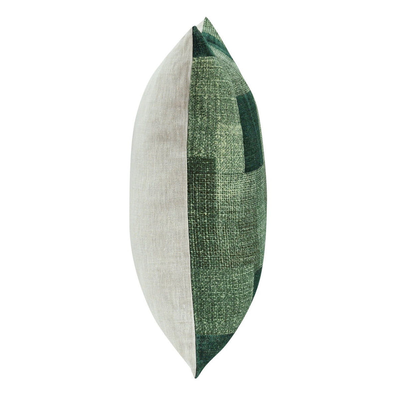 Folded throw pillow showing white side and green vertical patch stripe, textured fabric