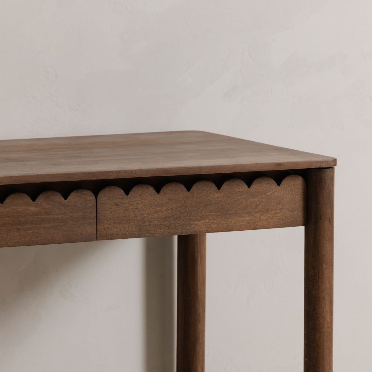 Vintage-brown desk tabletop with scalloped apron detail and drawer front
