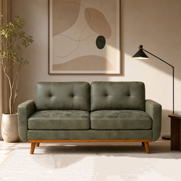 Two-seat sofa in muted gray-green upholstery with button-tufted back and wooden legs