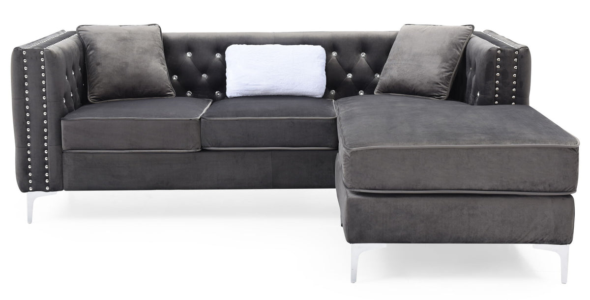 Dark gray fabric sofa chaise with tufted back, nailhead trim, and chaise extension
