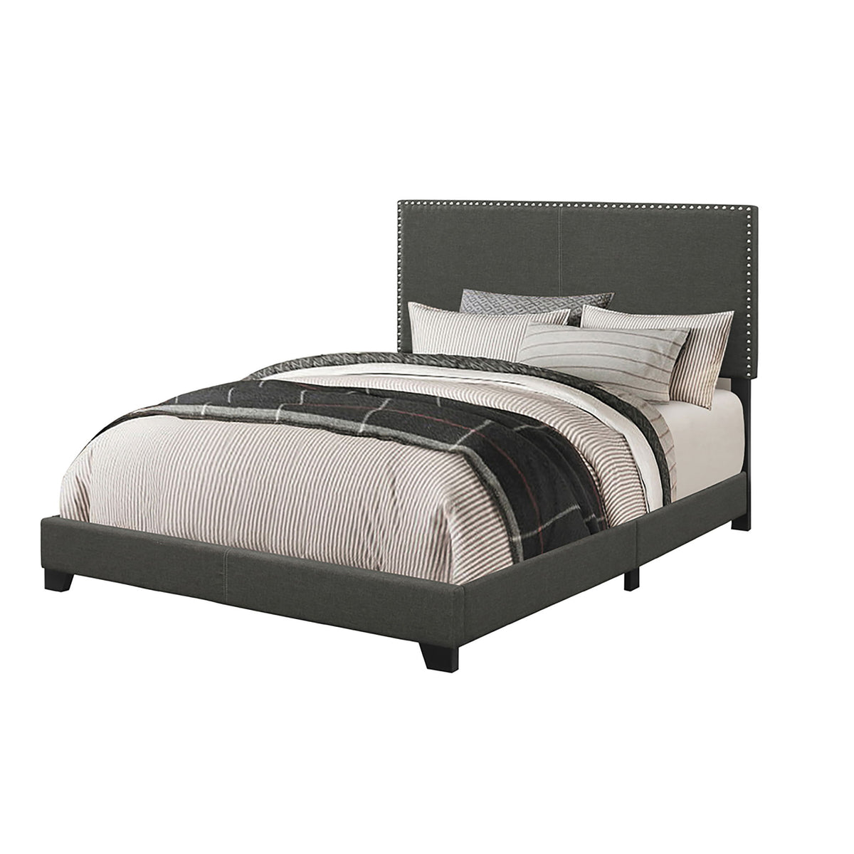 Dark gray upholstered bed with nailhead-trimmed headboard and platform base