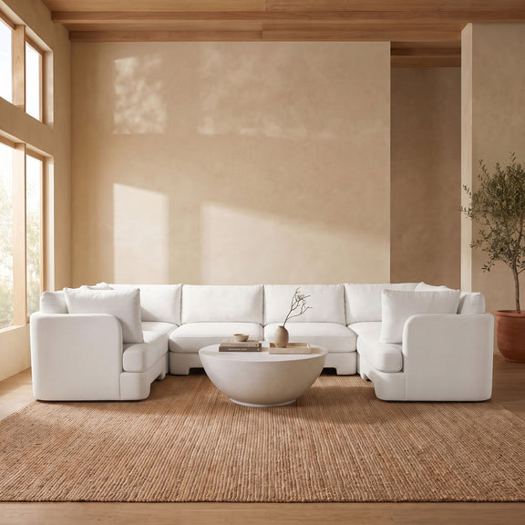 Beige U-shaped sectional sofa with three-seat center and wide arm cushions
