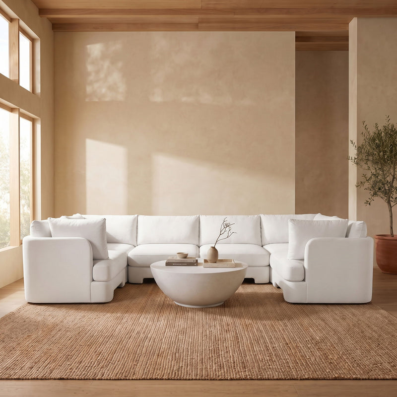 Beige U-shaped sectional sofa with three-seat center and wide arm cushions