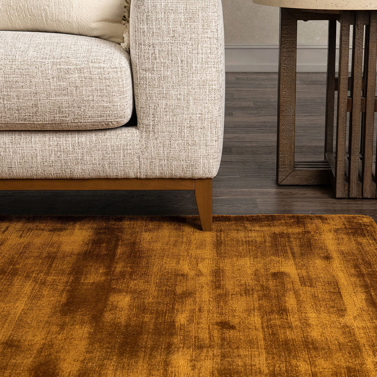 Mustard tan distressed area rug with vintage-style mottled texture