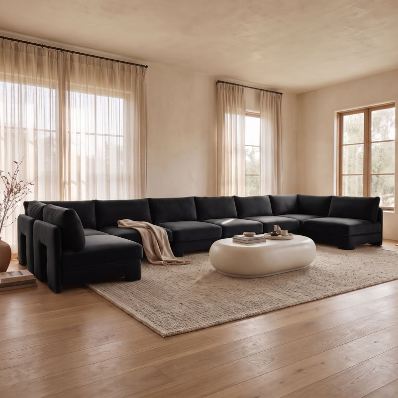 U-shaped armless sectional sofa with dark velvet upholstery and deep seat cushions