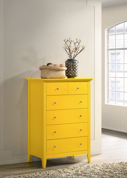 Yellow chest of drawers with six drawers and round metal knobs