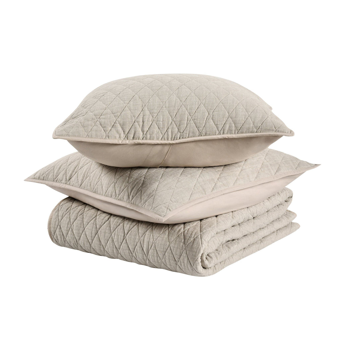 Stack of natural-toned quilt and pillows with diamond quilting, folded set