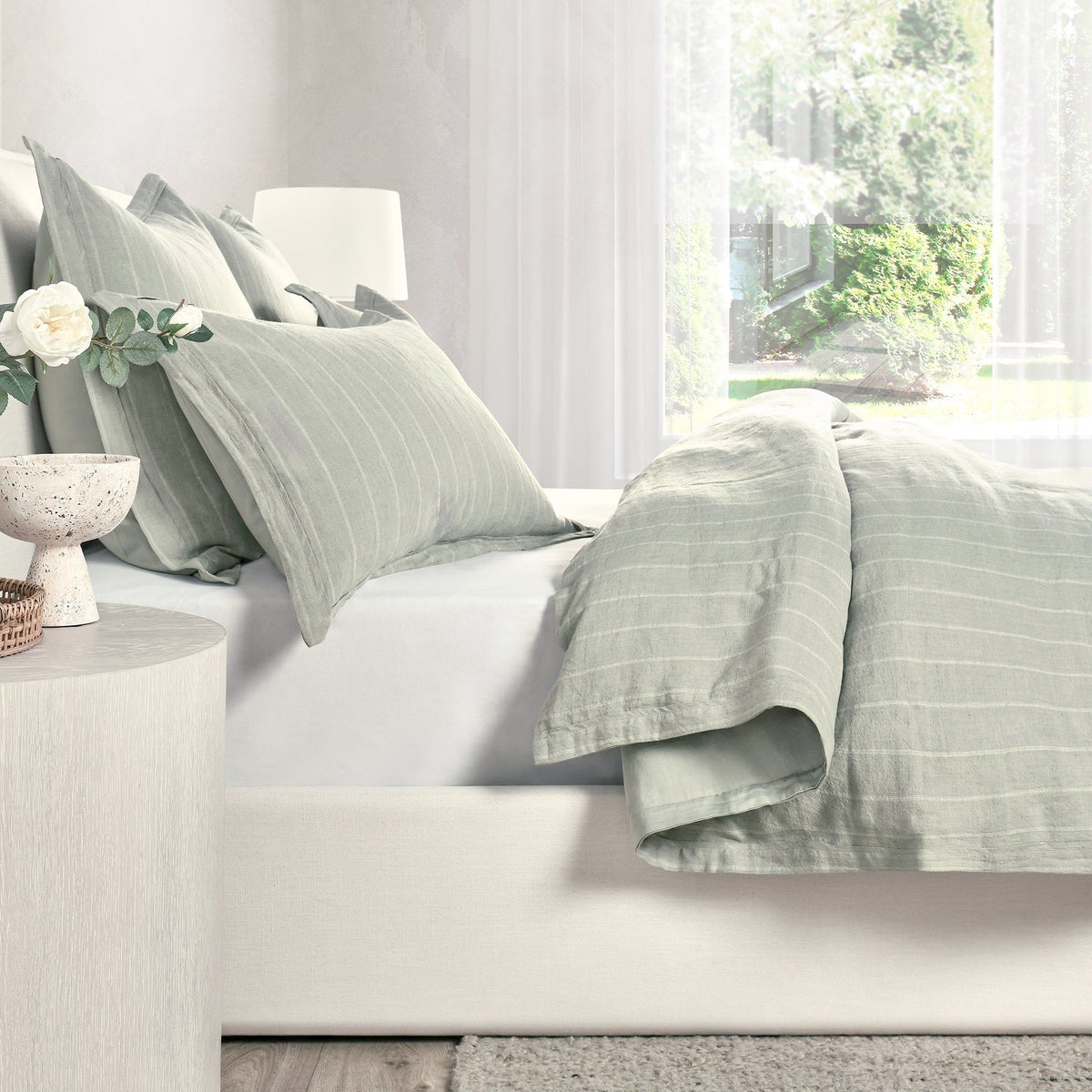 Light green king duvet cover with vertical stripe weave, open flap visible