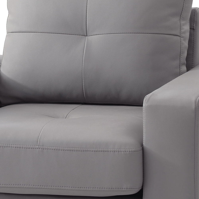 Gray accent chair upholstery close-up with stitched seams and padded arm