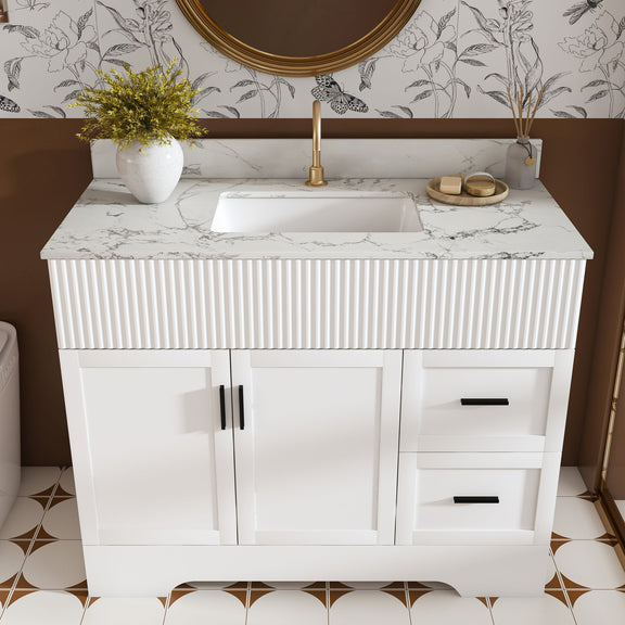 White bathroom vanity set with fluted cabinet, sink top, two doors and two drawers