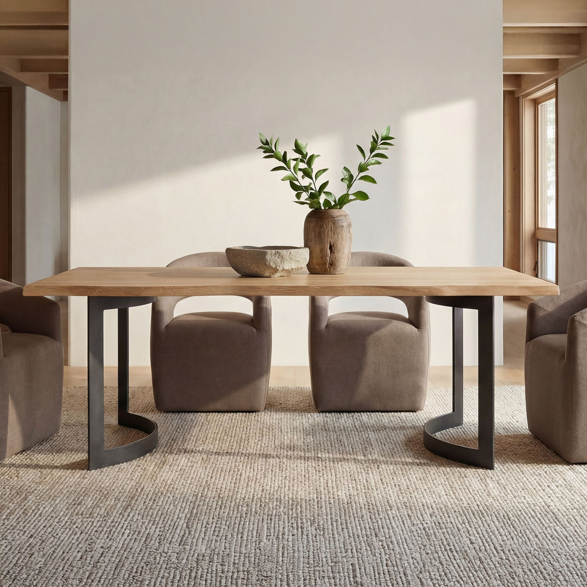 Small dining table with natural oak top and black bent legs, set for meals