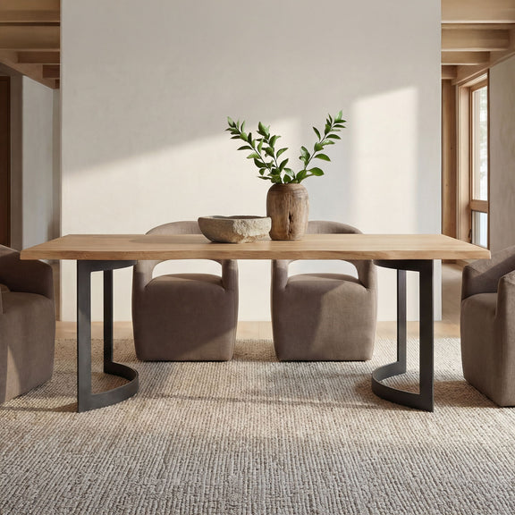 Small dining table with natural oak top and black bent legs, set for meals