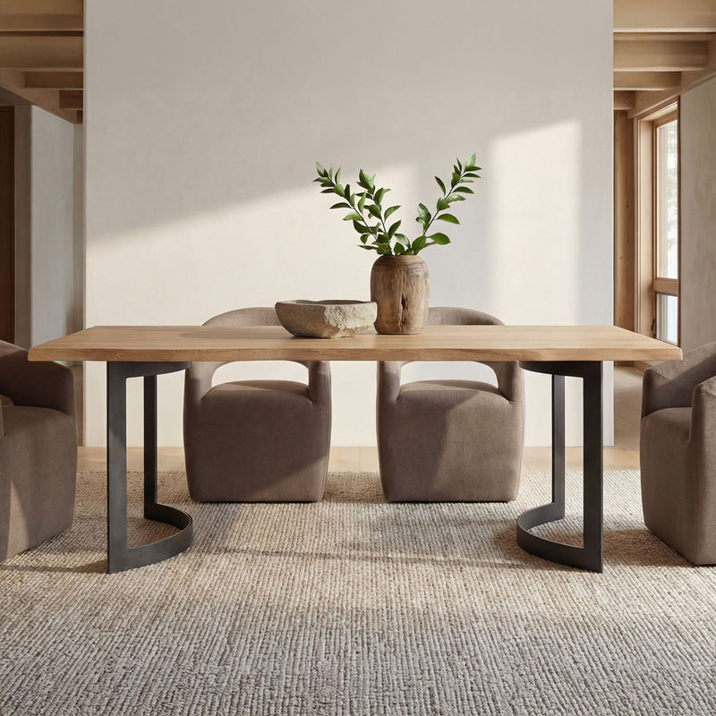 Small dining table with natural oak top and black bent legs, set for meals