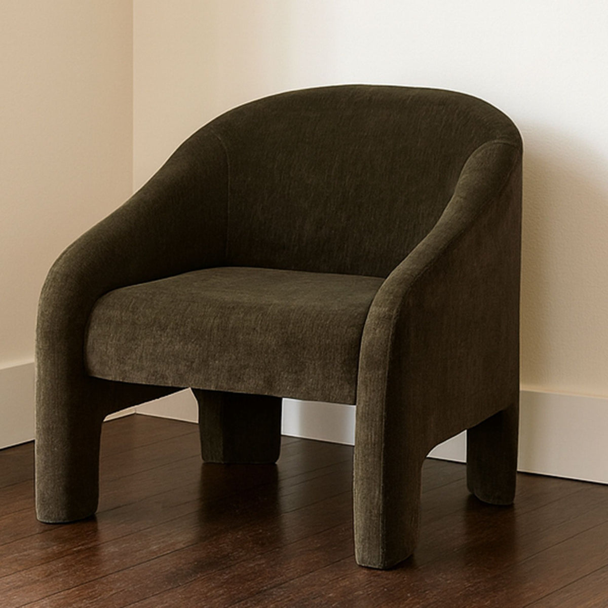 Green fabric accent chair with wide seat, rounded arms, and short tapered legs