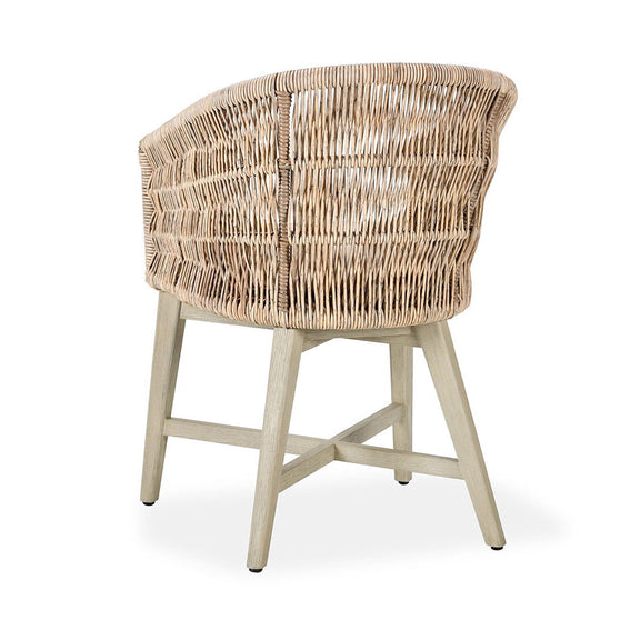 Outdoor dining chair angled view with woven wicker back and beige seat cushion
