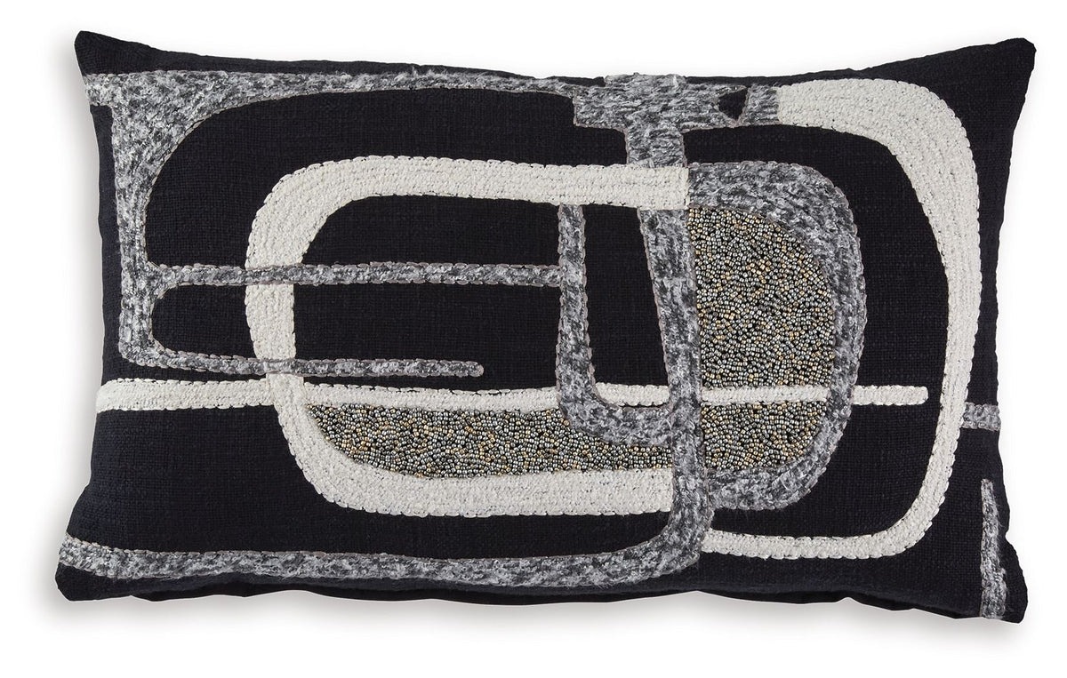 Decorative pillow with black, gray, and ivory abstract geometric pattern