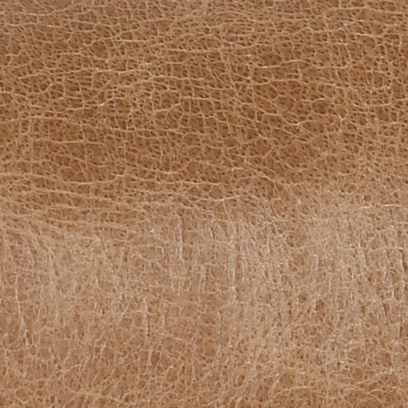 Tan leather upholstery texture close-up with fine grain pattern