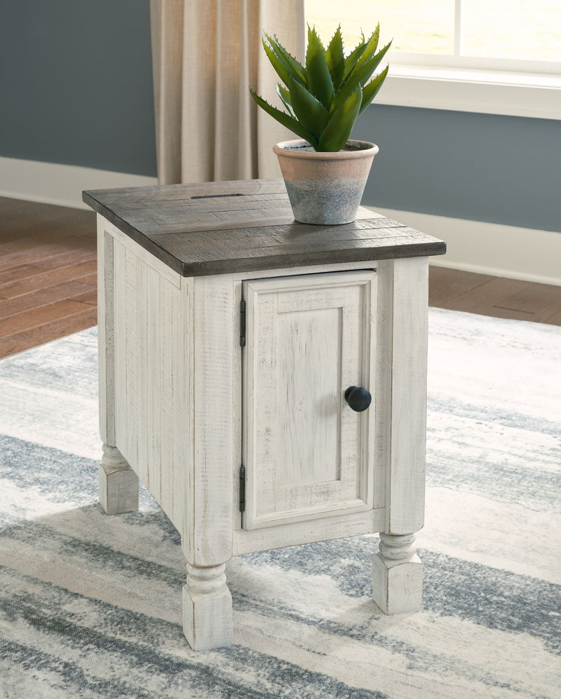 Chair side end table with dark top, white distressed cabinet, black round door knob