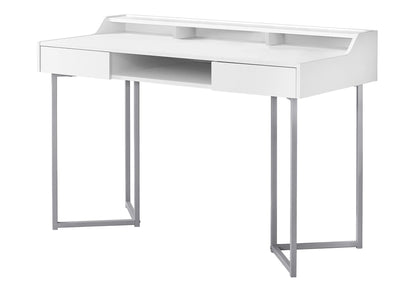 White computer desk with two drawers, open shelf, and light metal legs.
