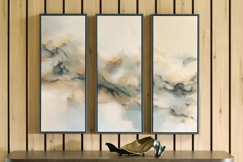 Set of 3 framed abstract landscape wall prints on wall, dark gray frames, cloudy tones