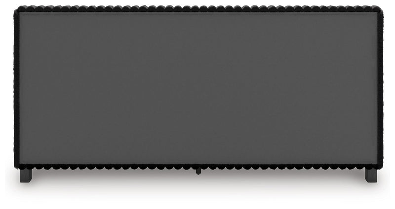 Black upholstered headboard panel with scalloped trim